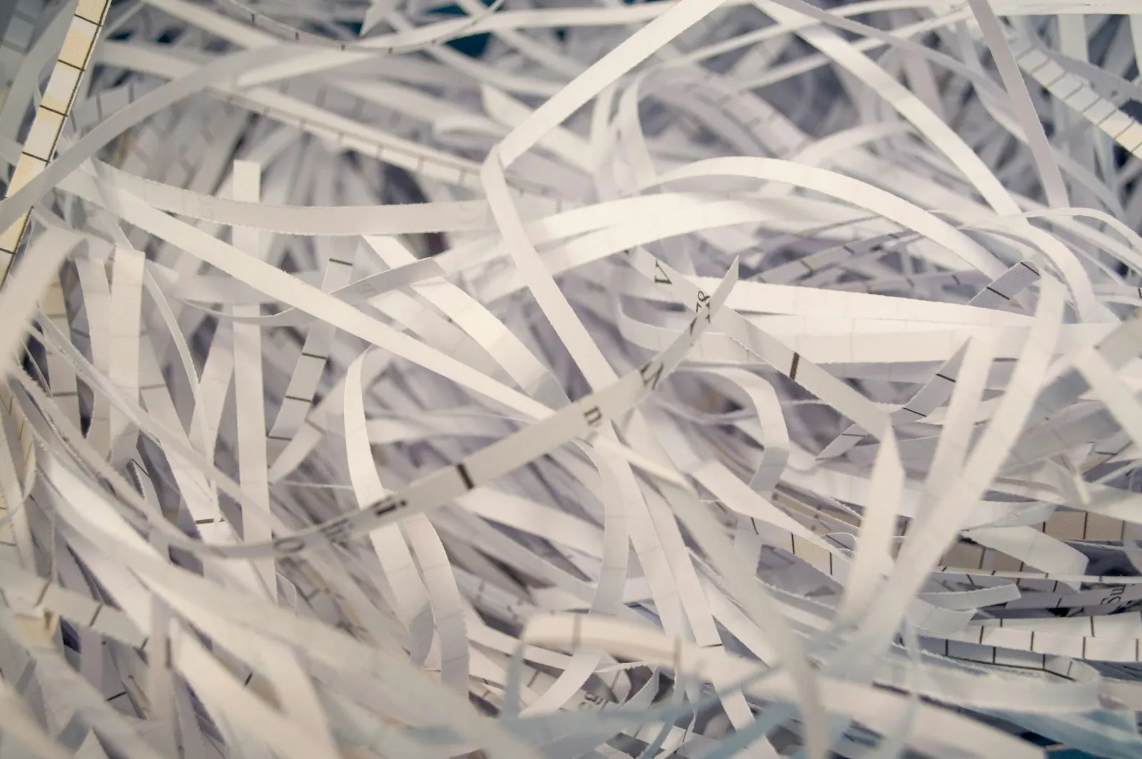 A pile of white shredded paper strips